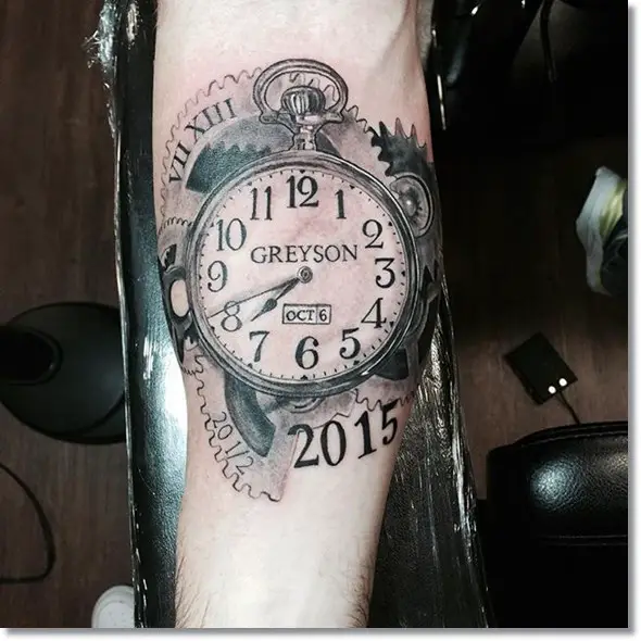 2015 pocket watch tattoo on forearm