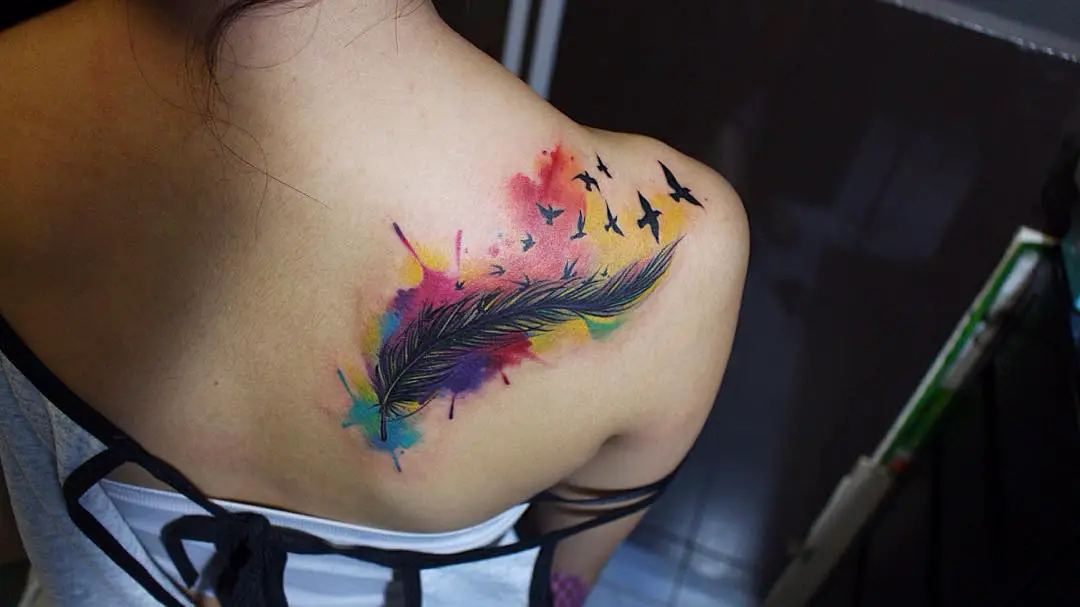 Feather tattoo turning into birds