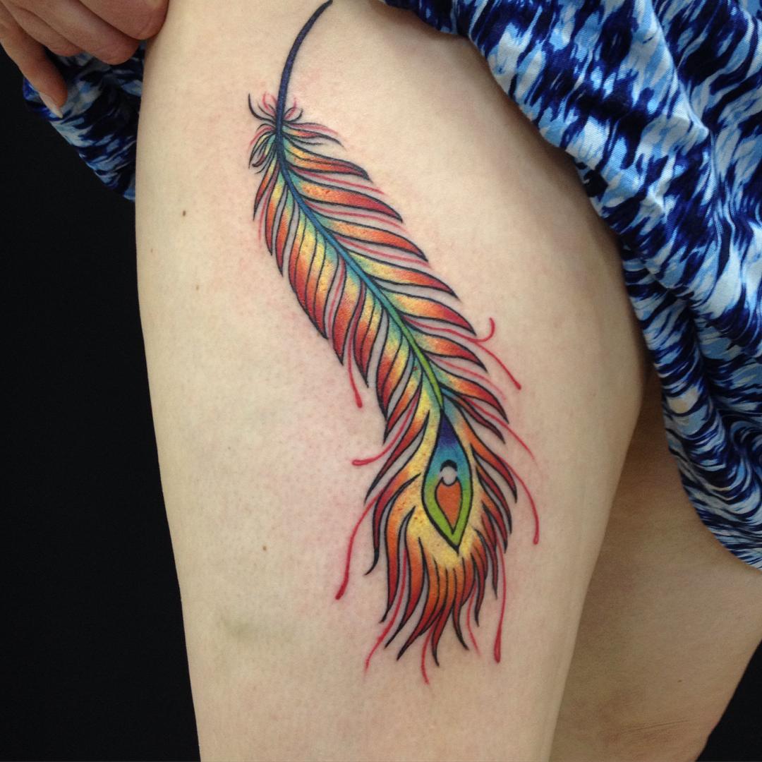 Feather tattoos for women on the thigh