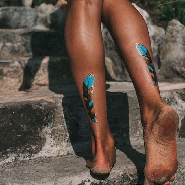 Feather tattoos on lower leg