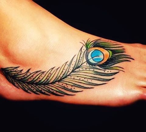 Peacock feather tattoo on foot