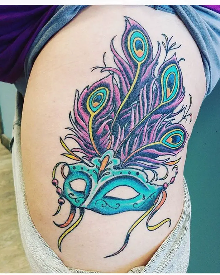 Peacock feather tattoo on ribs