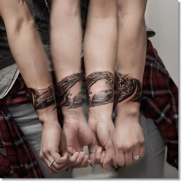 Pocket watch tattoo with wings