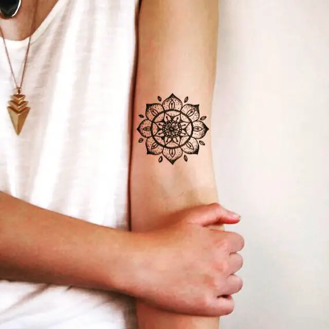 Small mandala tattoo on sleeve