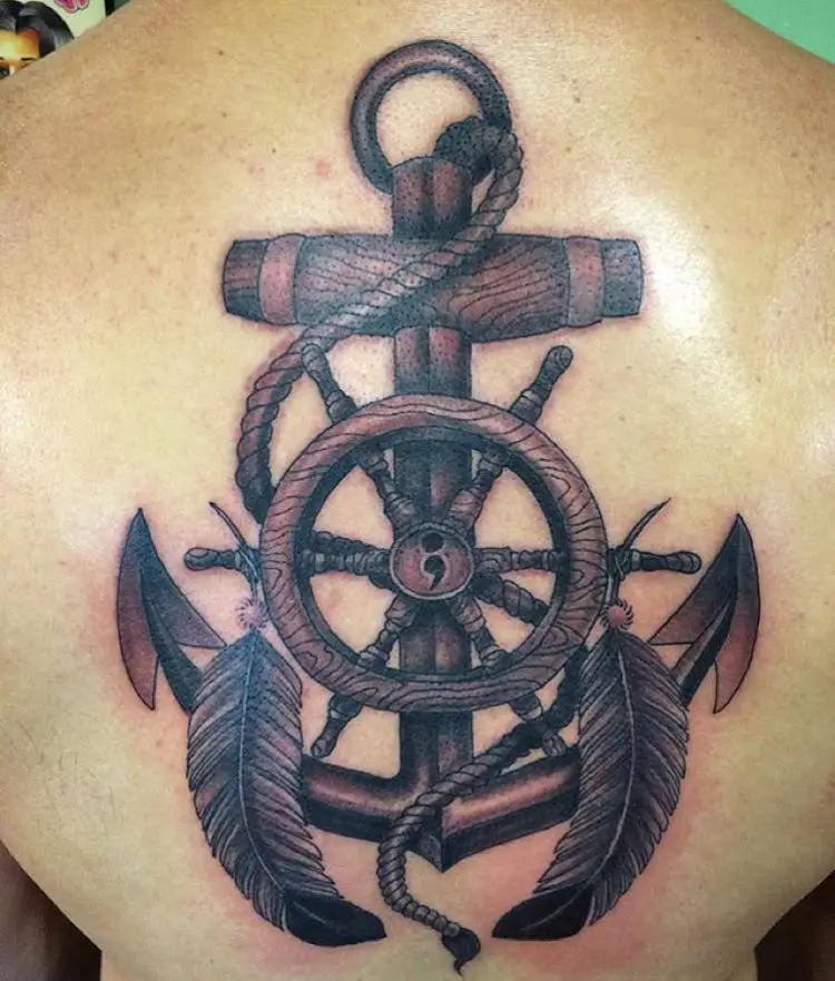 anchor and feather tattoo on back