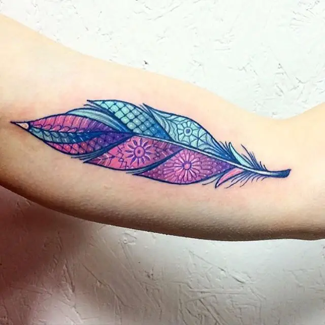 colorfull feather tattoo designs on outer arm