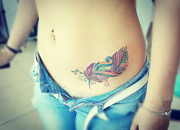 colorfull small feather tattoos on hip