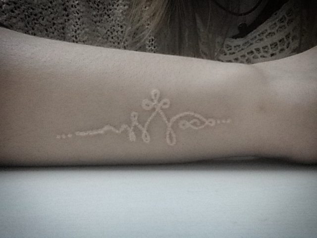 cute white ink symbol tattoo