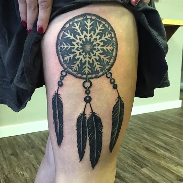 dreamcatcher snowflake tattoo on thigh