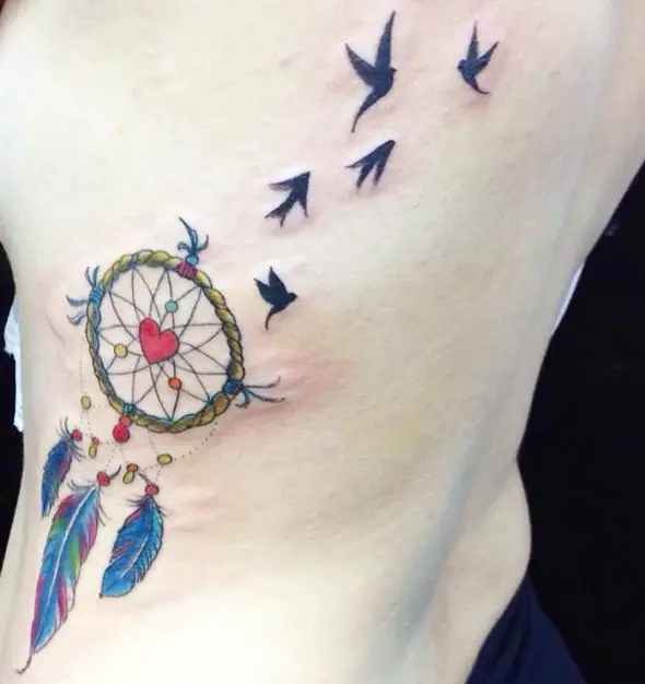 dreamcatcher tattoo ideas on ribs