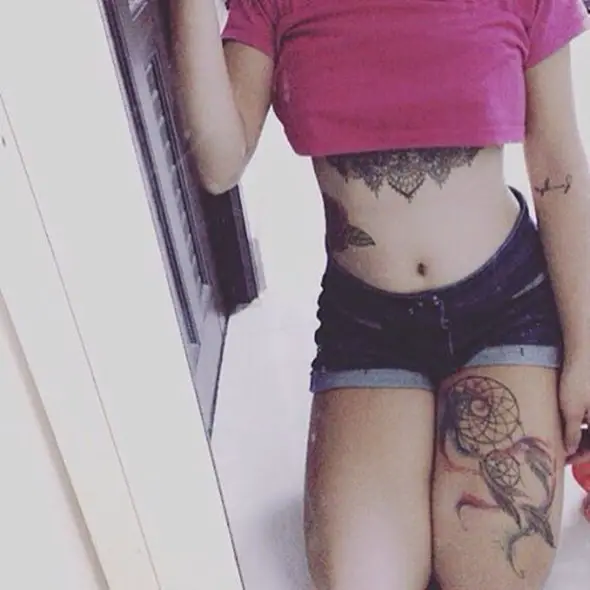 dreamcatcher tattoo on left thigh for girls
