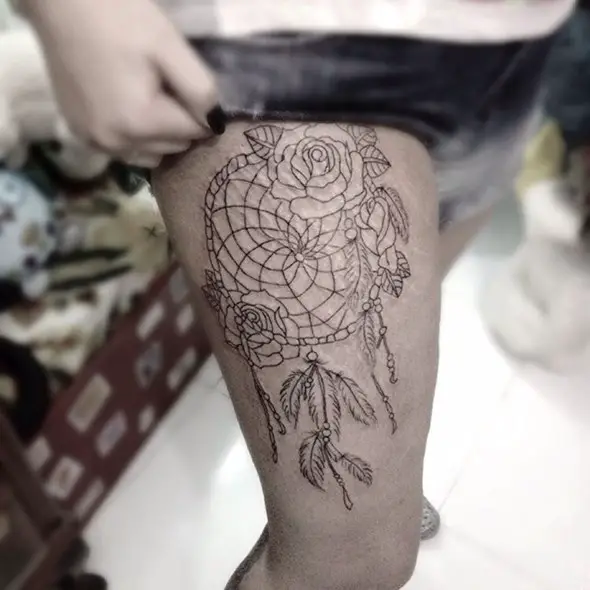 dreamcatcher tattoo on thigh for women