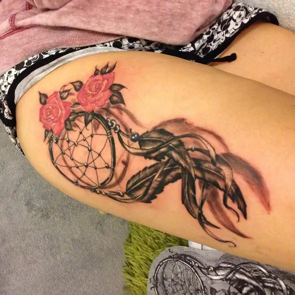 dreamcatcher tattoo with flower on thigh for girls