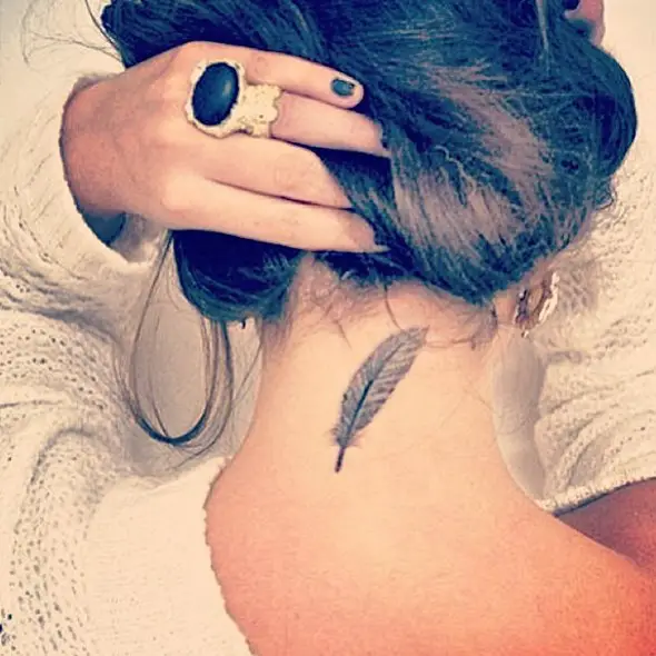 feminine small feather tattoo design on neck