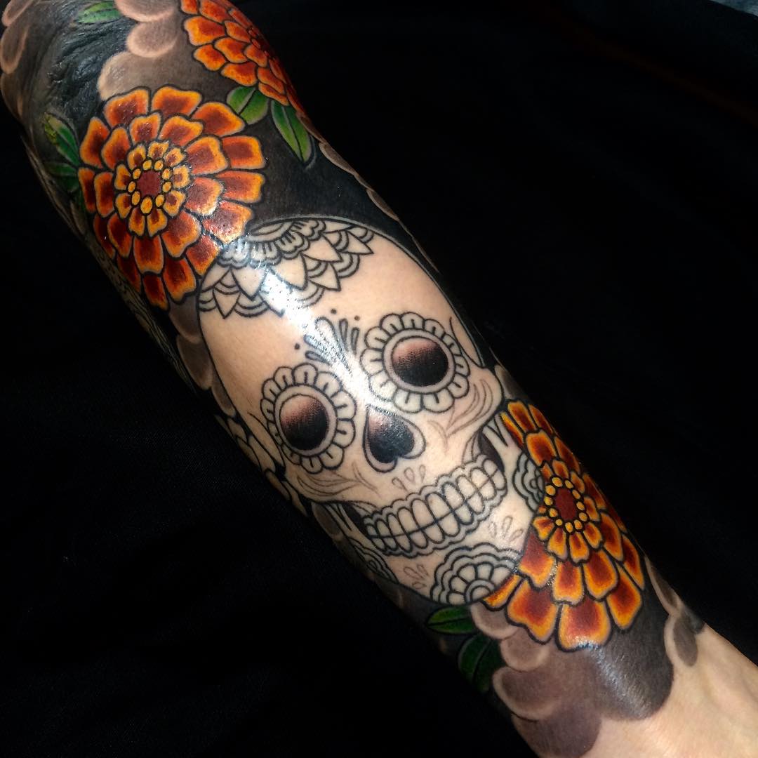 japanese skull and flower tattoo on sleeve