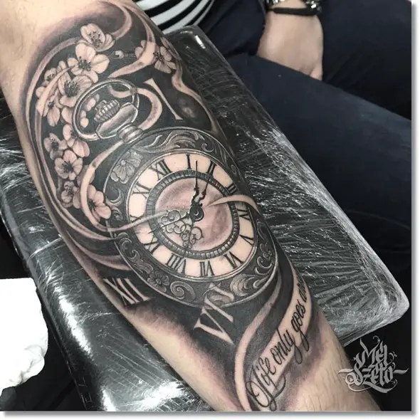 pocket watch black and gray tattoo on forearm