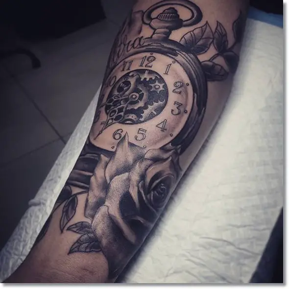 pocket watch tattoo design on forearm