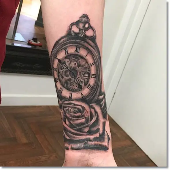 rose and pocket watch tattoo forearm