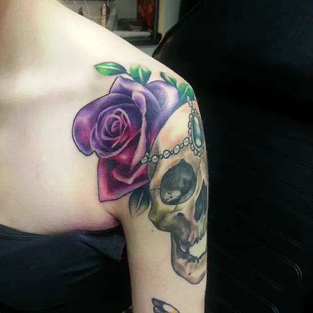 shoulder rose and skull tattoo