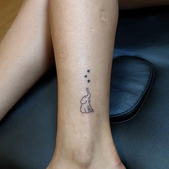 small baby elephant tattoo trunk up