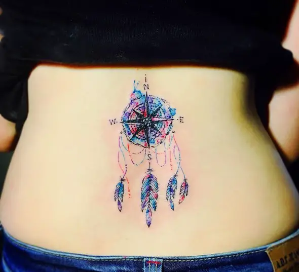 small dreamcatcher tattoo on lower back