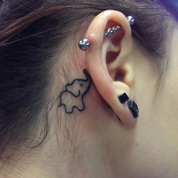 small elephant tattoo behind ear