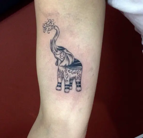 small elephant tattoo trunk up