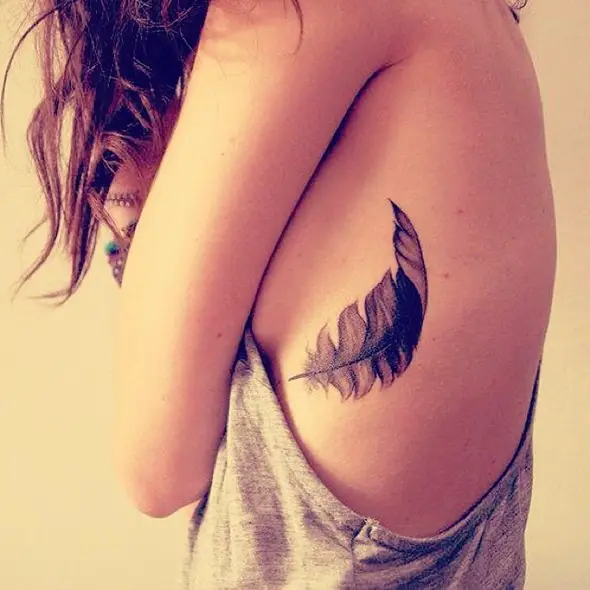 small feather rib tattoo