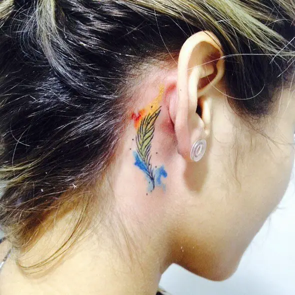 small feather tattoo behind the ear