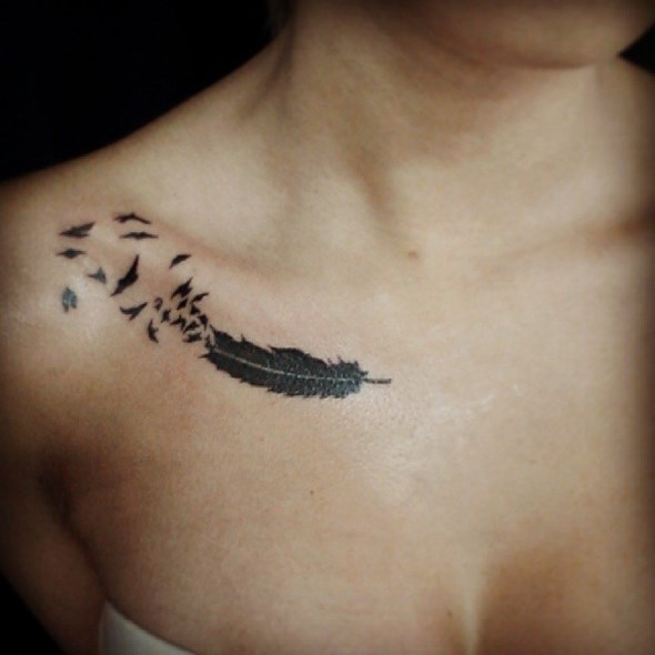 small feather tattoo with bird on collar bone