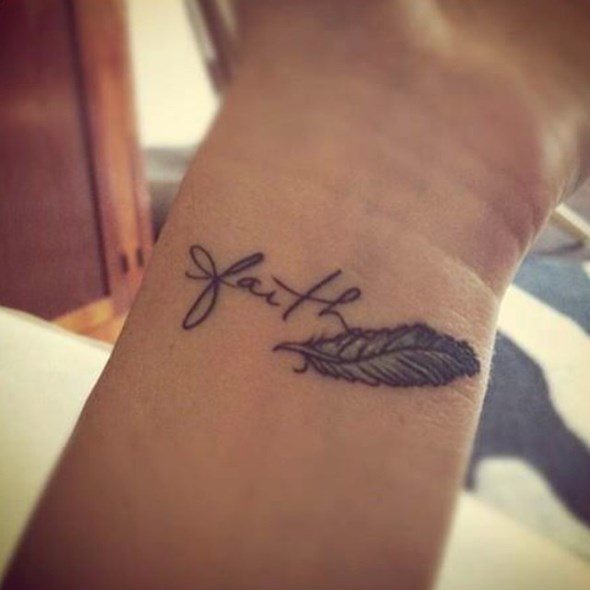 small feminine feather tattoo with names