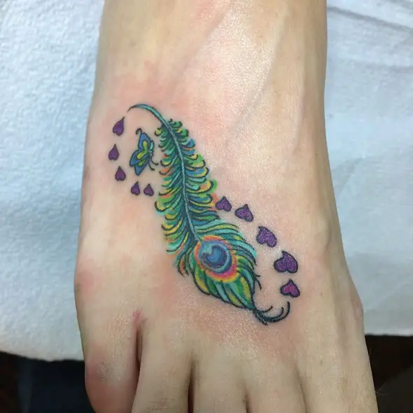 small peacock feather tattoo on foot