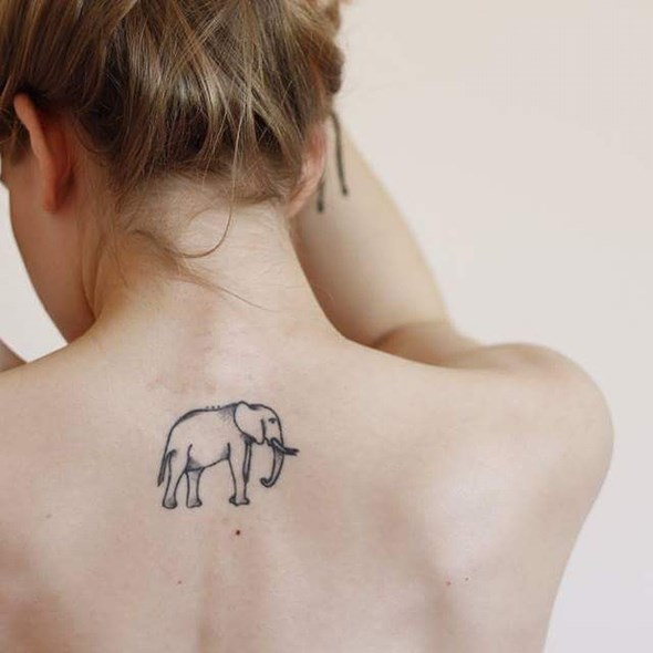 small simple elephant tattoo on back