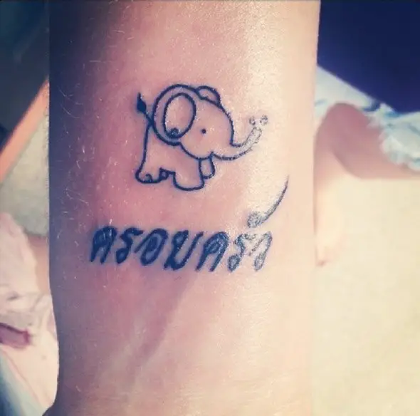 tiny elephant tattoo with name