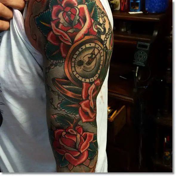 traditional pocket watch tattoo with roses