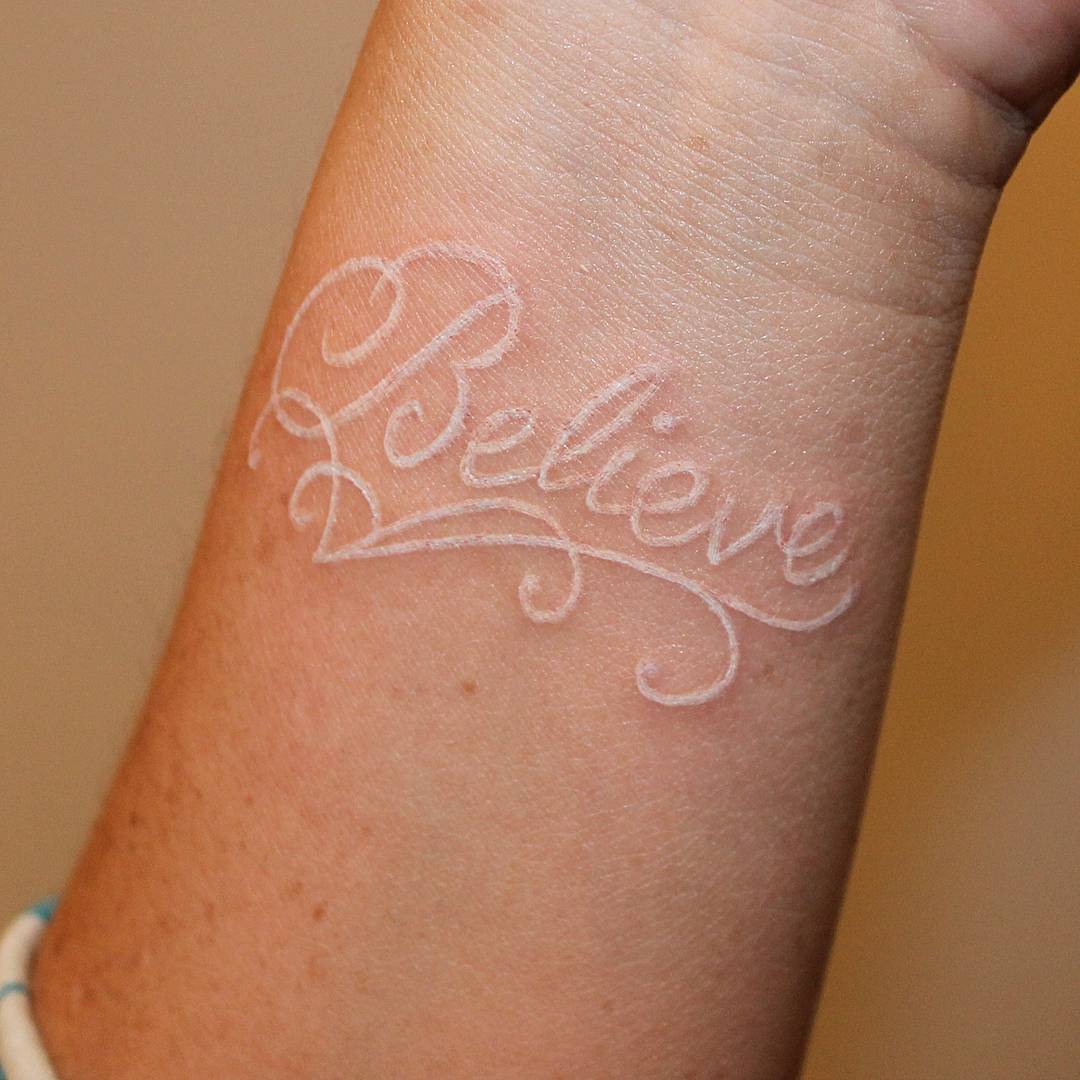 white ink believe tattoo