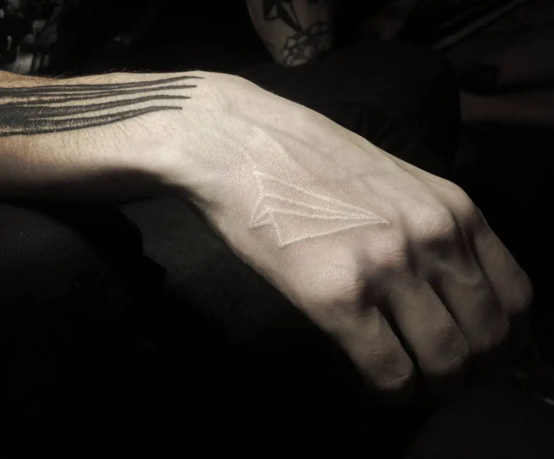 white ink handpoke tattoo