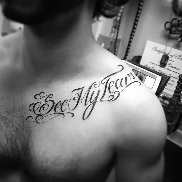 Freehand script collar bone tattoos for guys