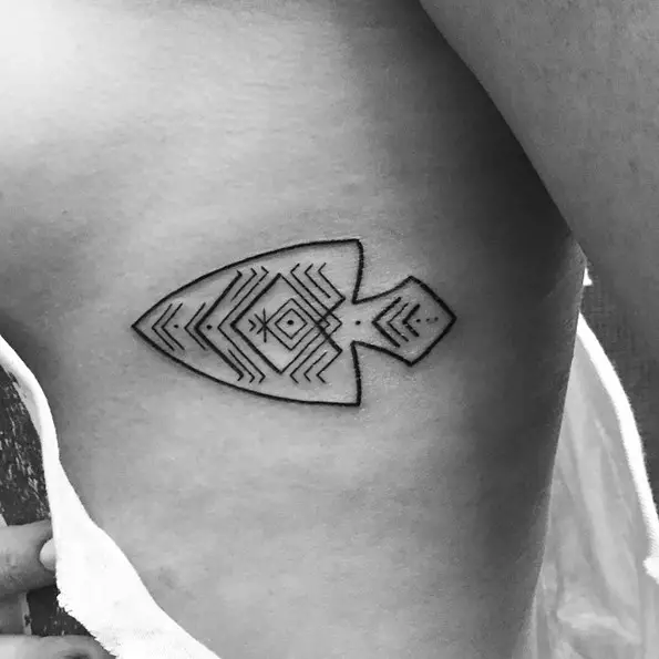 arrow head rib tattoo for women