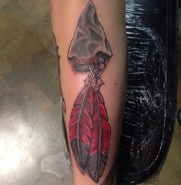 arrowhead feather tattoo with red lotus color