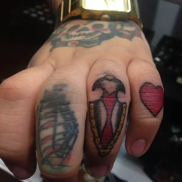 arrowhead knuckle tattoos