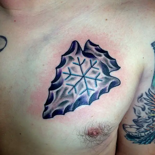 arrowhead tattoo engraved with a snowflake