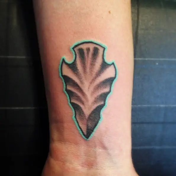 arrowhead tattoo with blue outline