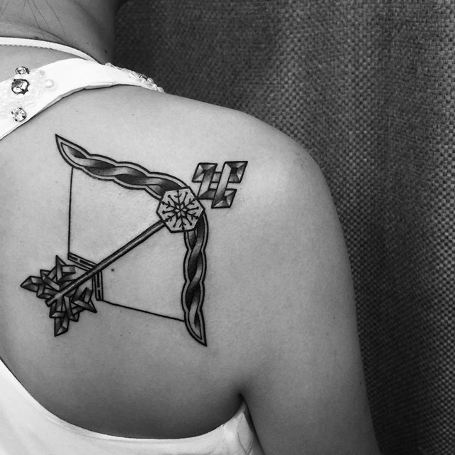 black-bow-and-arrow-shoulder-tattoo