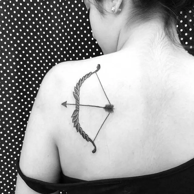 bow-and-arrow-on-back-tattoo