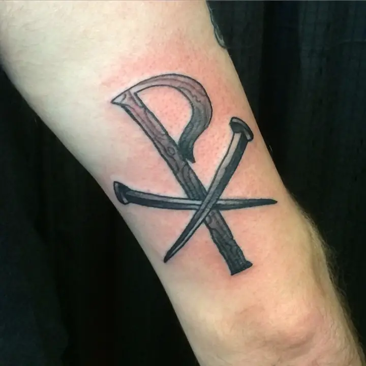 chi-rho-tattoo-behing-arm