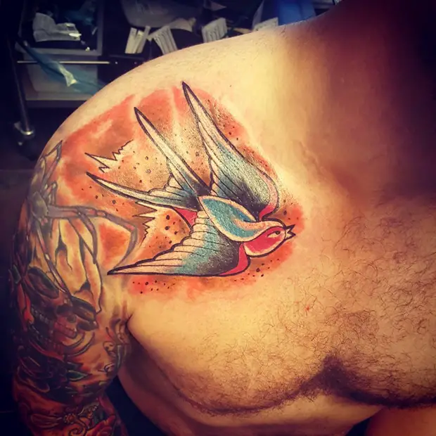 collar bone swallow tattoos for guys