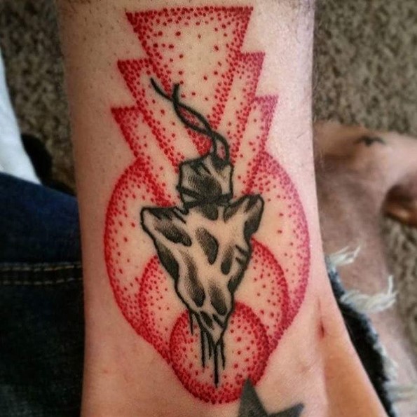 geometric arrowhead tattoo