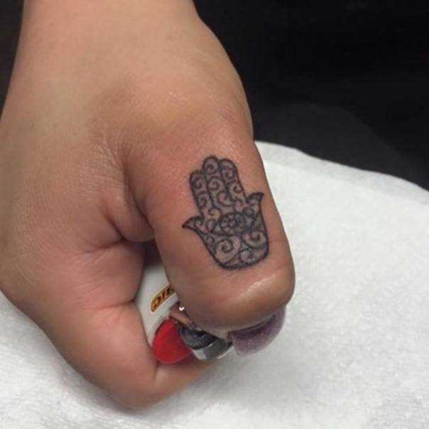 hamsa hand finger tattoo