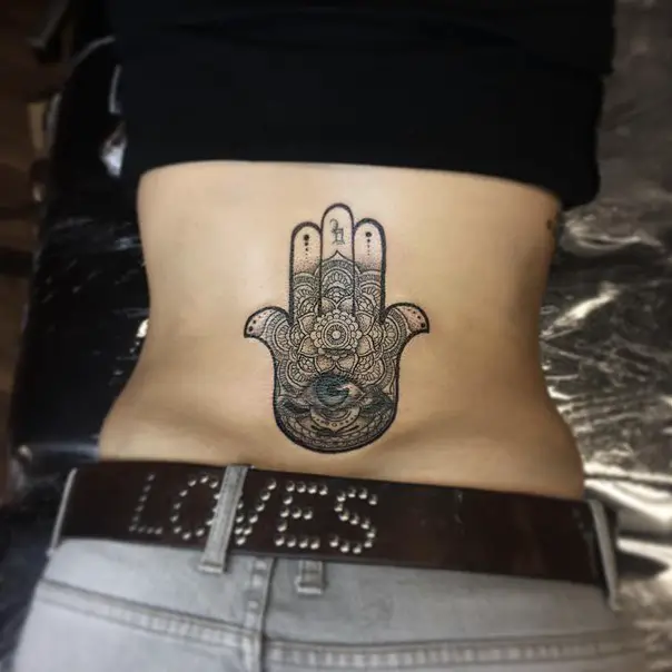 hamsa hand lower back tattoo
